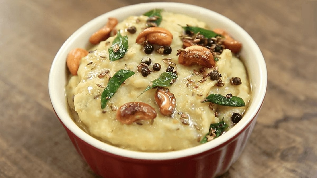 Sweet Pongal Recipe: Sweet porridge like dish made with rice and mung lentils, flavored with cardamoms and dry fruits. Learn how to make pongal with easy steps.